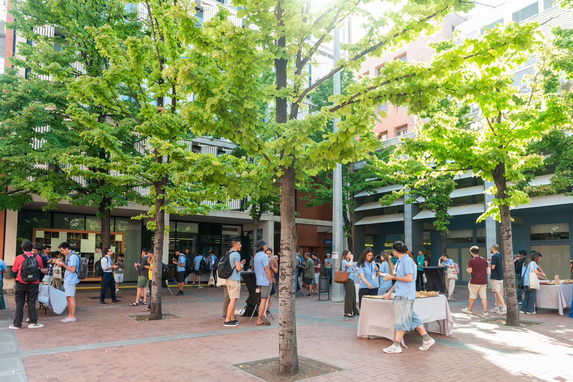 Photo of Students socializing during a break at the 2025 ACM Summer School on HPC & AI