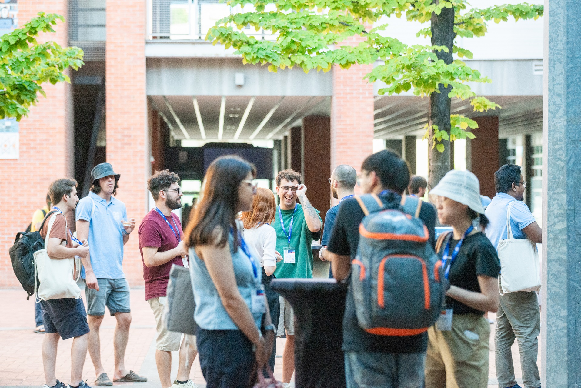 Photo of Students socializing during a break at the 2025 ACM Summer School on HPC & AI