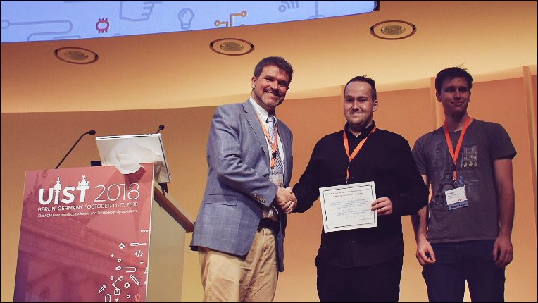 ACM Europe Council Best Paper Award presented by Aaron Quigley to Patrick Parzer and Florian Perteneder at UIST 2018